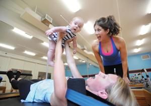 Moms are slimming down and toning up by doing squats with tots