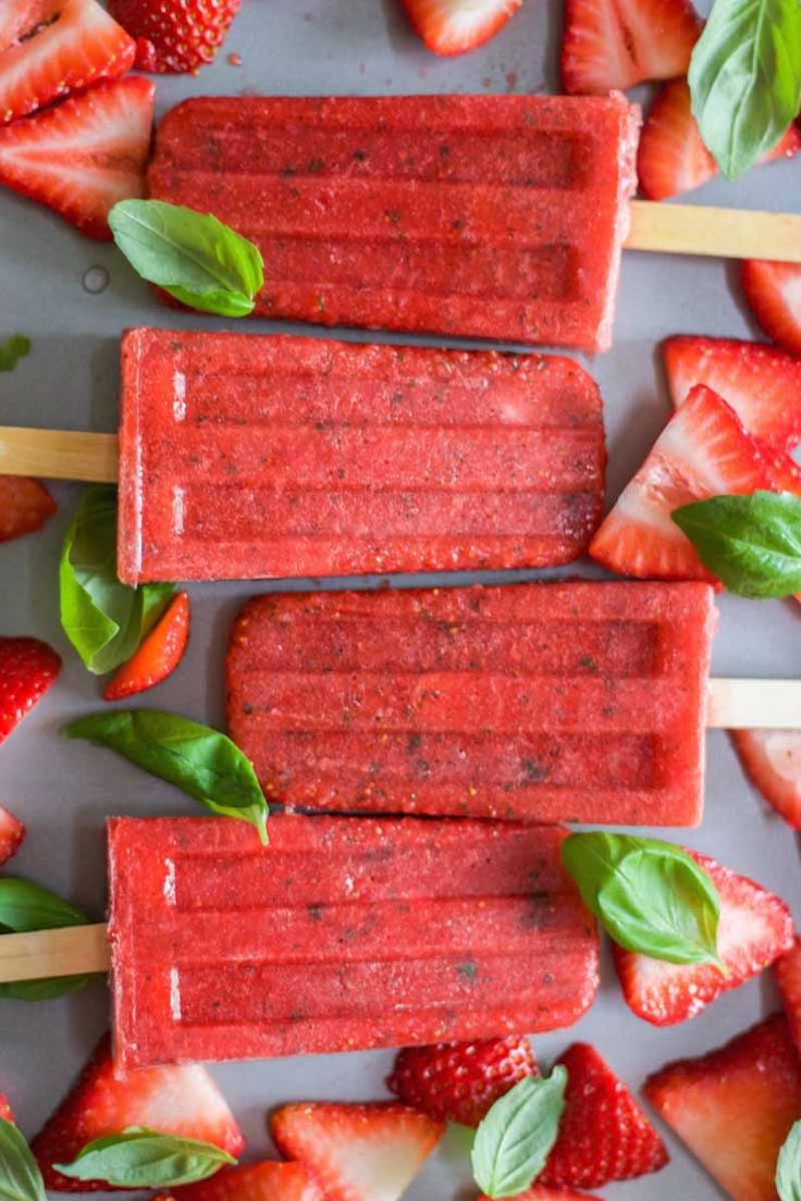 Paleo and healthy three ingredient strawberry basil popsicles! This recipe is ea...